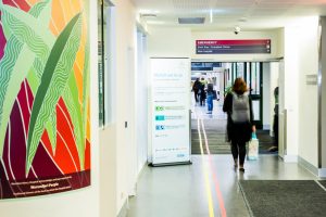 Woman walking in hospital