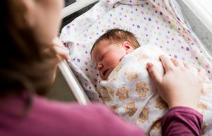 Mother and sleeping baby
