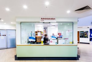 A long shot of the Administration Clerk desk.